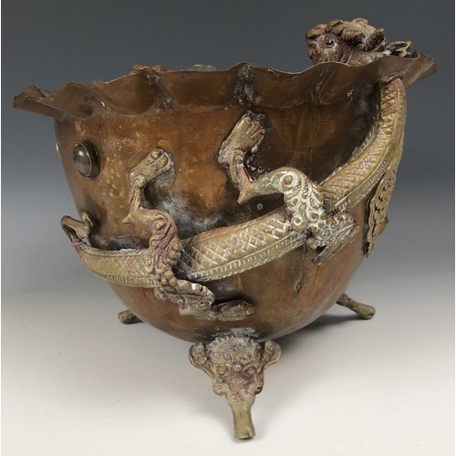 1546 - An Eastern brass oil lamp, 60 cm wide, and a brass and copper vase, decorated dragons, 49 cm high an... 