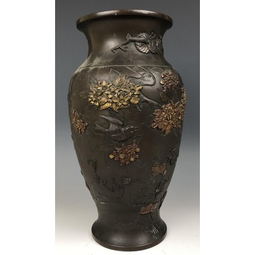 1570 - A Japanese bronze vase, decorated birds and foliage, impressed mark to base, 30 cm high