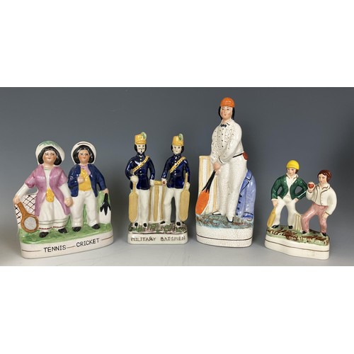 637 - A reproduction Staffordshire figure, of W G Grace, assorted other reproduction Staffordshire figures... 