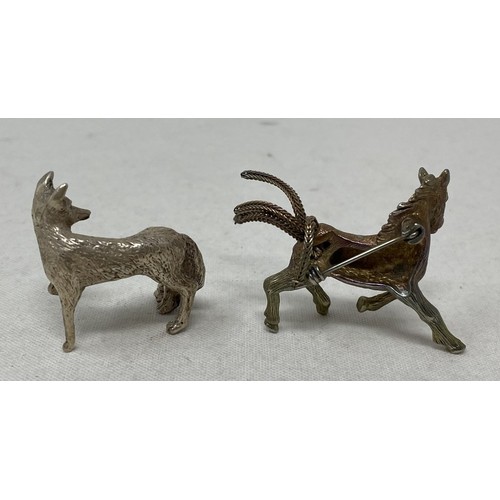 718 - A pair of novelty silver plated knife rests, in the form of greyhounds, a brooch in the form of a ho... 