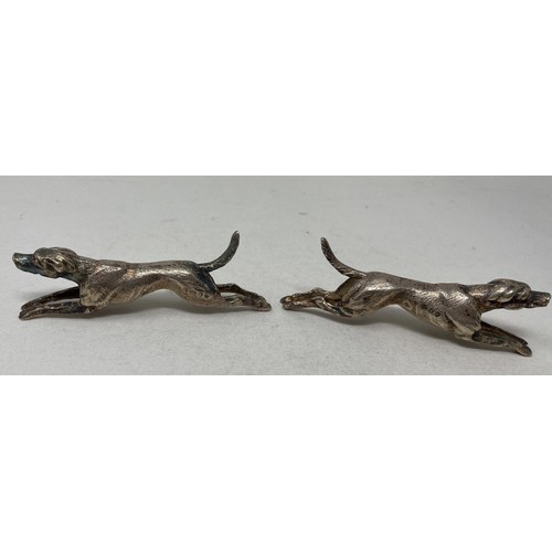 719 - A pair of novelty silver knife rests, in the form of running hounds