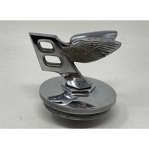 264 - A 1939 Bentley B forward leaning wings mascot, numbered and with original Bentley cap, taken from a ... 