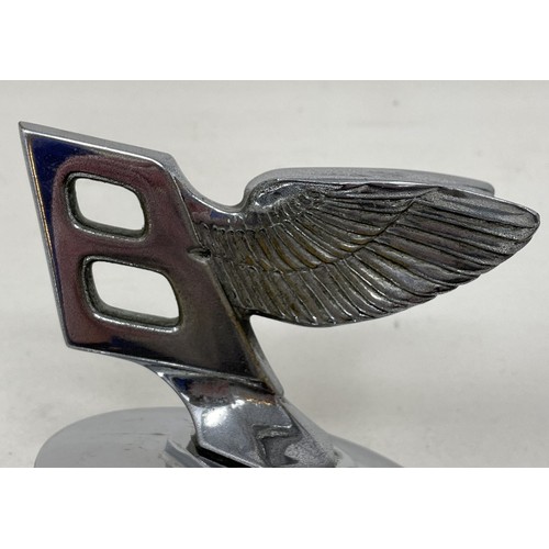 264 - A 1939 Bentley B forward leaning wings mascot, numbered and with original Bentley cap, taken from a ... 