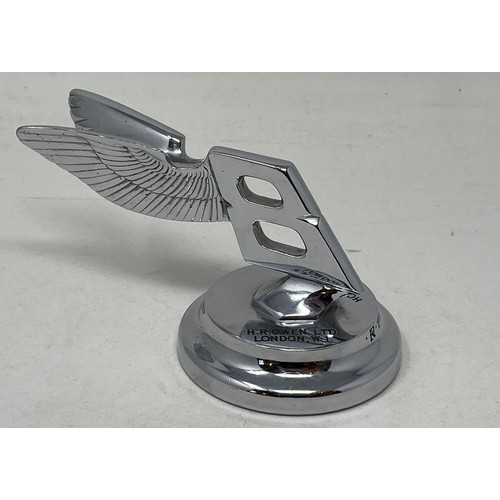 265 - A rare Bentley desk paperweight, in the form of a backward winged Bentley mascot, inscribed H.R. Owe... 