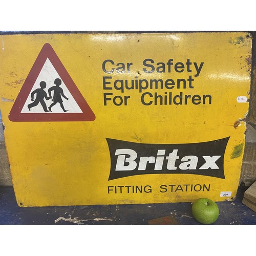 220 - An enamel sign, Britax Fitting Station, Car Safety Equipment for Children, 56 x 76 cm