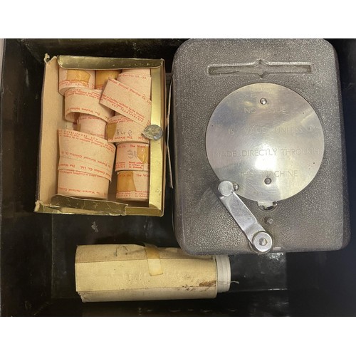 314 - A Bell Punch Company ticket machine, and a small group of tickets, in a tin box