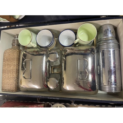 382 - A four piece picnic set, the Finnigans rexine covered case opening to reveal a fitted interior with ... 