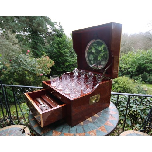 323 - An impressive travelling cocktail set, for eight persons, with cut glass accessories, the mahogany c... 