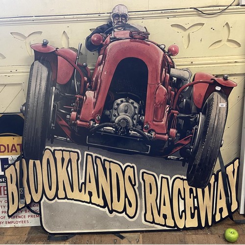 476 - A large modern Brooklands Raceway painted wood sign, 150 cm wide