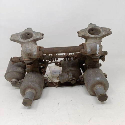 255 - A pair of 1 1/4 inch SU carburettors, 6 7/8 inch between centres, on a manifold