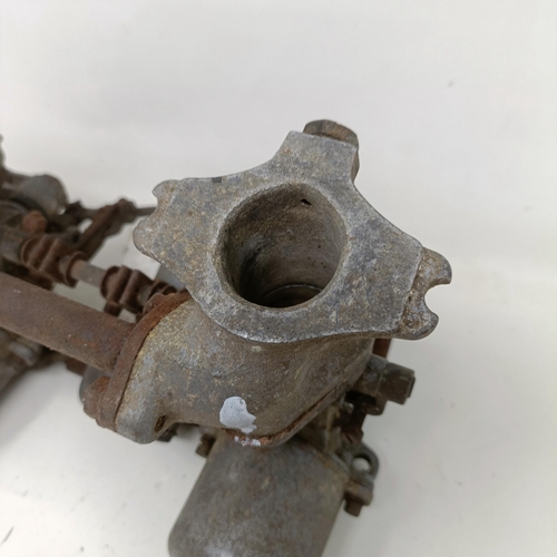 255 - A pair of 1 1/4 inch SU carburettors, 6 7/8 inch between centres, on a manifold