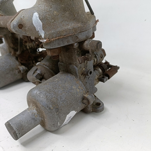 255 - A pair of 1 1/4 inch SU carburettors, 6 7/8 inch between centres, on a manifold