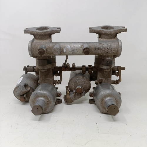 256 - A pair of 1 1/4 inch SU carburettors, 6 inches between centres, on a manifold