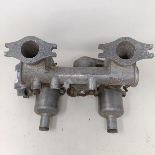 256 - A pair of 1 1/4 inch SU carburettors, 6 inches between centres, on a manifold