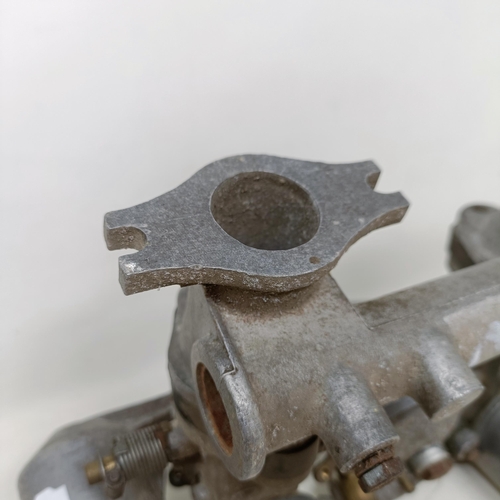 256 - A pair of 1 1/4 inch SU carburettors, 6 inches between centres, on a manifold