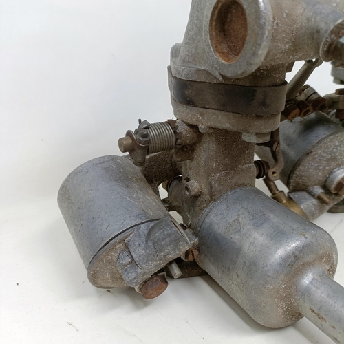 256 - A pair of 1 1/4 inch SU carburettors, 6 inches between centres, on a manifold