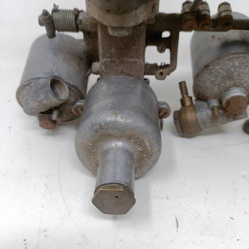 256 - A pair of 1 1/4 inch SU carburettors, 6 inches between centres, on a manifold