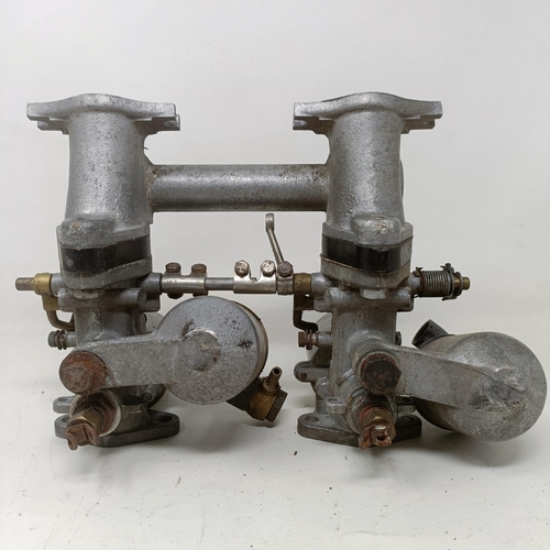 256 - A pair of 1 1/4 inch SU carburettors, 6 inches between centres, on a manifold