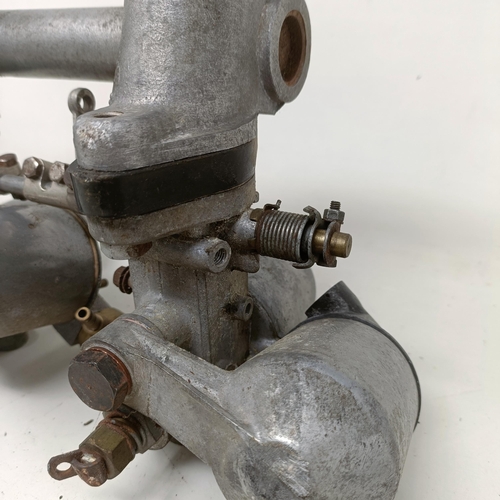 256 - A pair of 1 1/4 inch SU carburettors, 6 inches between centres, on a manifold