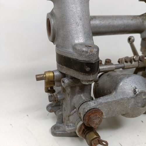 256 - A pair of 1 1/4 inch SU carburettors, 6 inches between centres, on a manifold