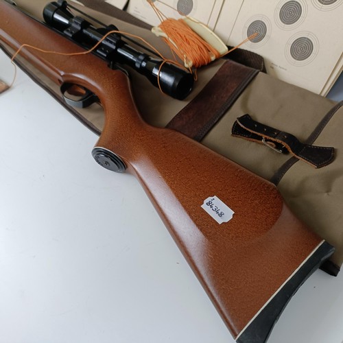 657 - A Webley .22 air rifle, with a Bentley telescopic sight, a carry bag, a painted tin fox target and v... 