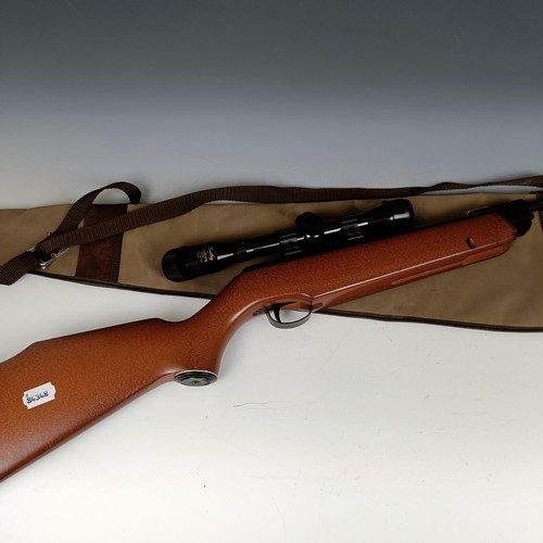 657 - A Webley .22 air rifle, with a Bentley telescopic sight, a carry bag, a painted tin fox target and v... 