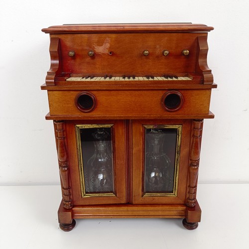 1827 - An early 20th century Continental musical tantalus/liqueur cabinet, in the form of a piano or organ,... 