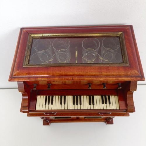 1827 - An early 20th century Continental musical tantalus/liqueur cabinet, in the form of a piano or organ,... 