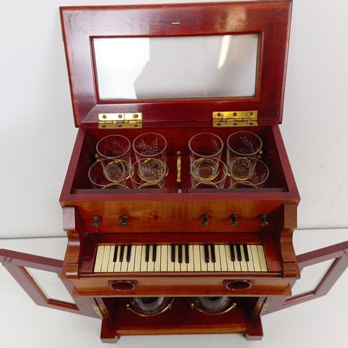 1827 - An early 20th century Continental musical tantalus/liqueur cabinet, in the form of a piano or organ,... 