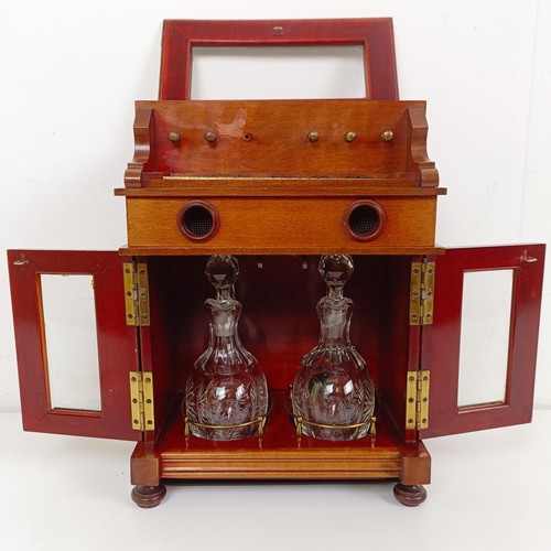 1827 - An early 20th century Continental musical tantalus/liqueur cabinet, in the form of a piano or organ,... 