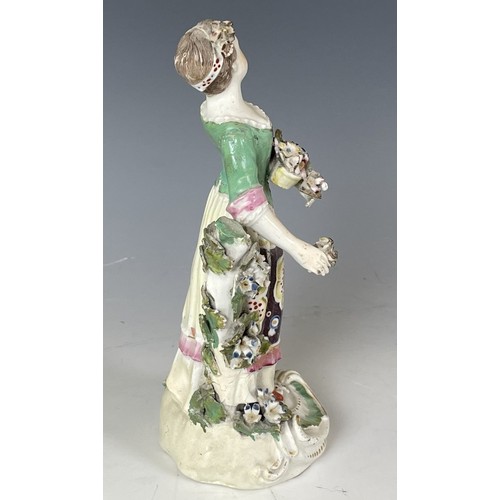 1858 - A porcelain figure of a young woman, 20 cm high, and another figure, 23 cm high (2)