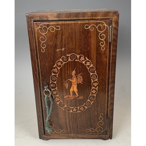 1863 - A 19th century Italian table top collectors cabinet, inlaid with figures, the hinged door to reveal ... 