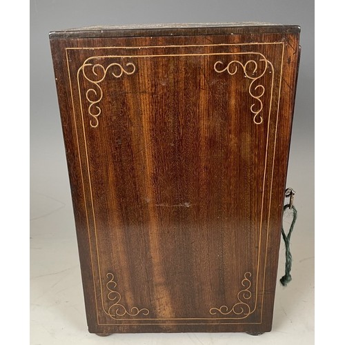 1863 - A 19th century Italian table top collectors cabinet, inlaid with figures, the hinged door to reveal ... 