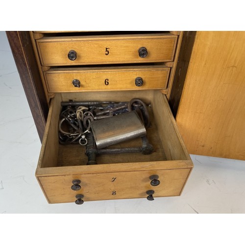 1863 - A 19th century Italian table top collectors cabinet, inlaid with figures, the hinged door to reveal ... 