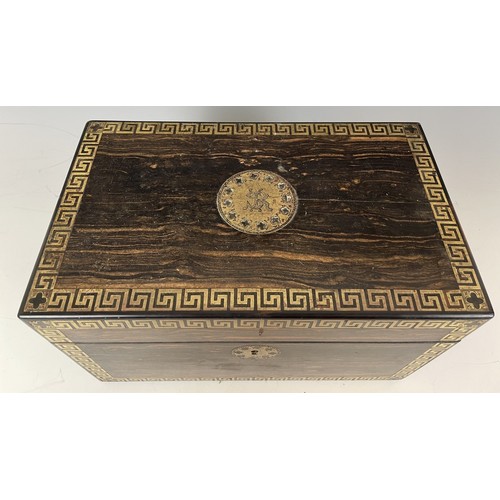 1864 - A 19th century coromandel and brass inlaid tea caddy, fitted two satinwood caddies, 26 cm wide