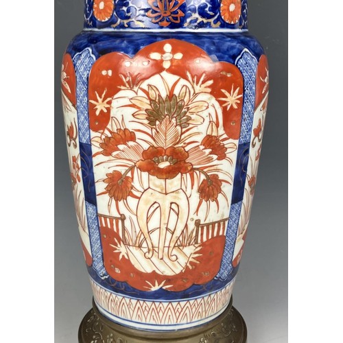 1800 - A Japanese Imari vase, converted to an oil lamp, with an acid etched glass shade, 46 cm high, and an... 