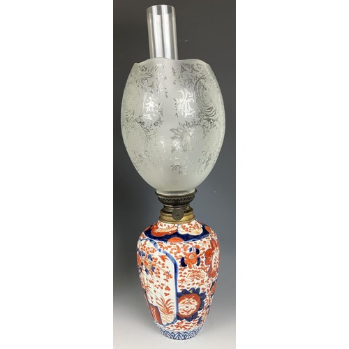 1800 - A Japanese Imari vase, converted to an oil lamp, with an acid etched glass shade, 46 cm high, and an... 