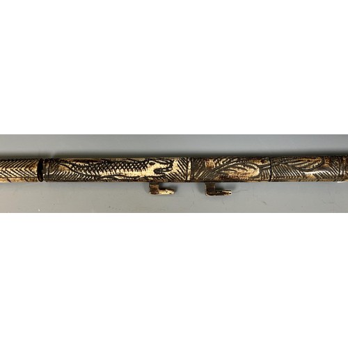 1805 - A carved bone blow pipe, in the form of a dragon, probably from Borneo, 82 cm