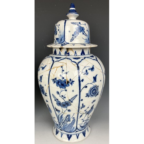 1806 - A pair of Delft blue and white vases and covers, 45 cm high