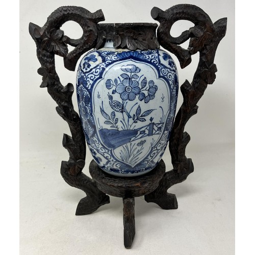 1814 - A blue and white Delft vase and cover, 30 cm high, and another with a Chinese style wooden mount (2)