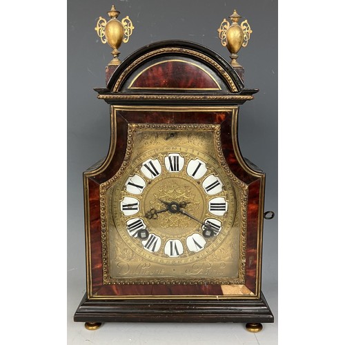 1823 - A mantel clock, with a gilt metal and enamel dial, striking on a bell, in a tortoiseshell ebonised a... 