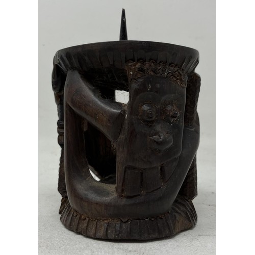 1824 - An African carved wooden bowl, 17 cm diameter, and a candle stand, probably from Makonde, 19 cm high... 