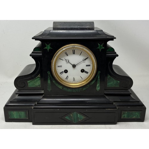 1828 - A mantel clock, in a polished slate case, 35 cm wide, and three others (4)