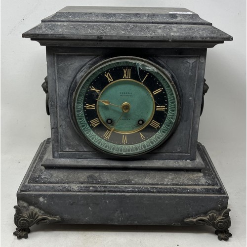 1828 - A mantel clock, in a polished slate case, 35 cm wide, and three others (4)