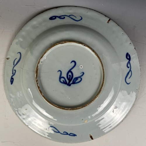 1852 - Three blue and white Delft plates (3)