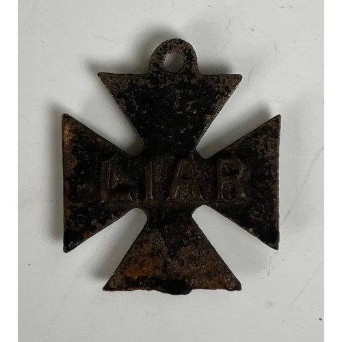 1872 - An early 20th century novelty cross medal, reading 'For brave deeds', the reverse reading 'Liar' ass... 