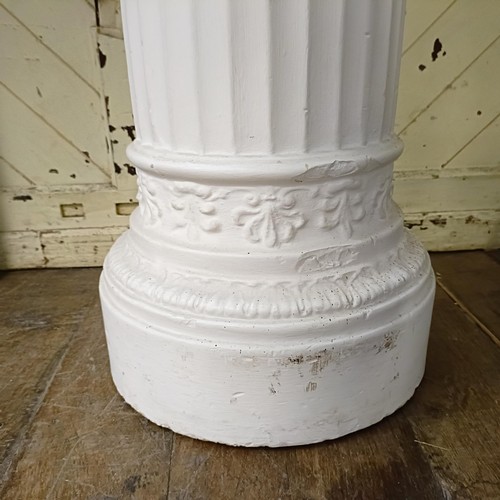 1903 - A plaster composition figure, of a young boy holding a bowl with outstretched arms, on a column base... 