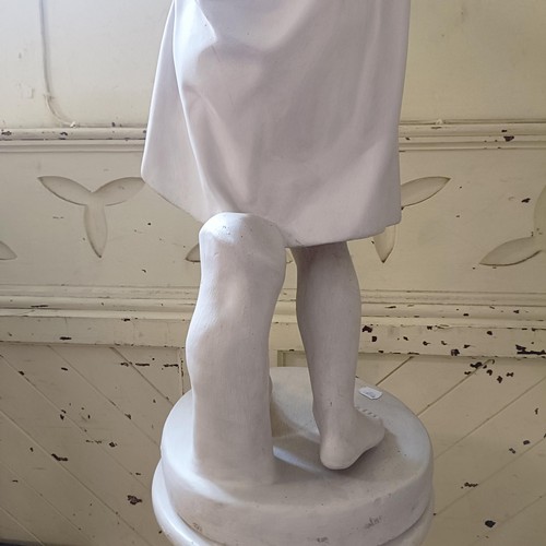 1903 - A plaster composition figure, of a young boy holding a bowl with outstretched arms, on a column base... 