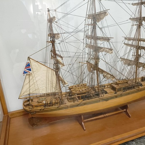 1886 - A model of the Cutty Sark, in a teak and perspex case, 140 cm wide