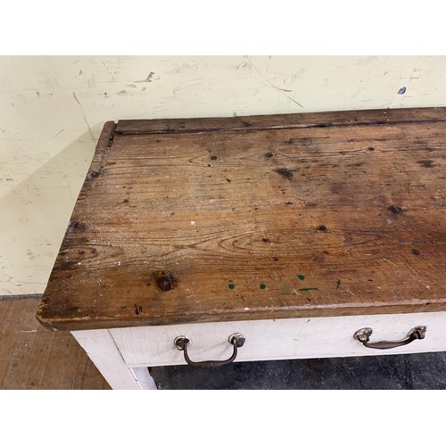 2003 - A Country house painted and stripped pine dresser base, having three drawers, 250 cm wide